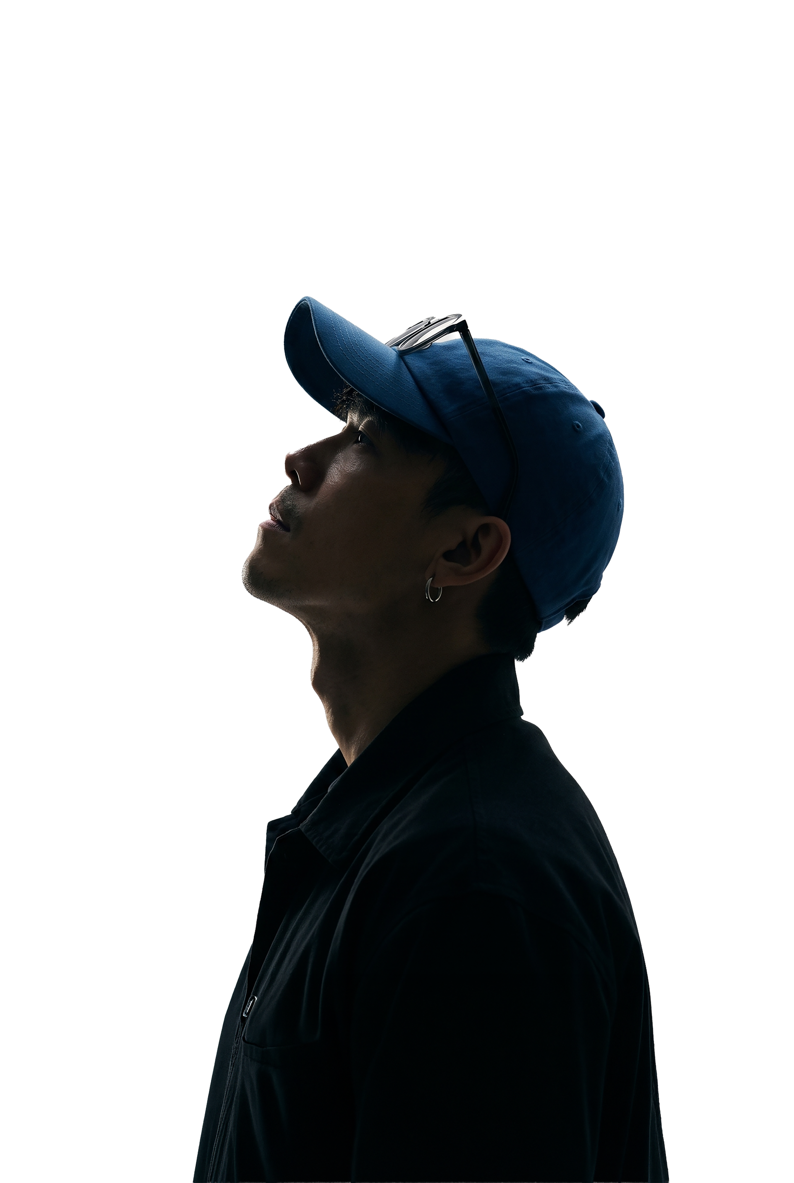 Portrait of Alvin Ong, multidisciplinary creative director, looking upward